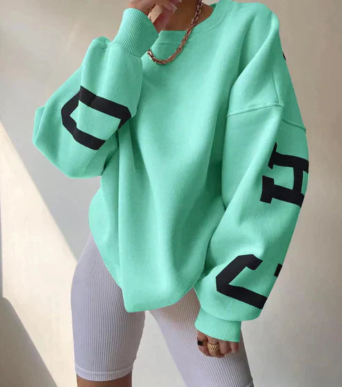 Oversized, trendy jumper with letters on the sleeves for women